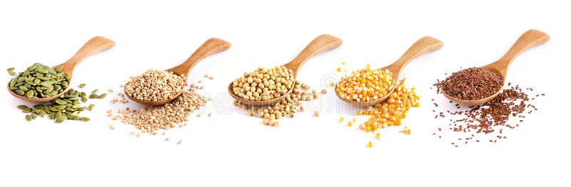 Collection of dry organic cereal and grain seeds in wooden spoon on white background