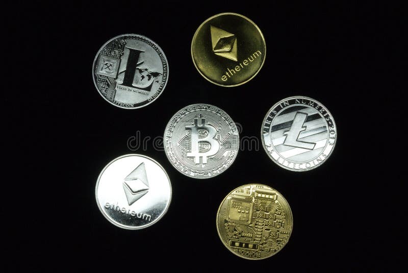 A collection of gold and silver cryptocurrency coins stock image A collection of gold and silver cryptocurrency coins stock image
