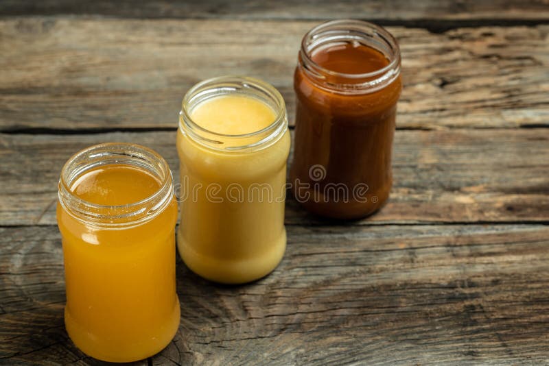 Collection of Jars of Different Types of Honey, Light, Dark and Cream