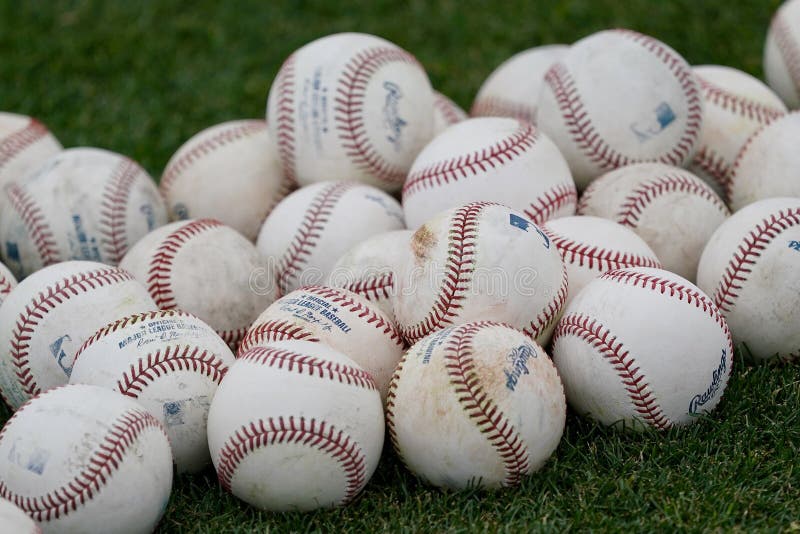 Baseball Ball Background on Infield Grass Stock Photo - Image of ...