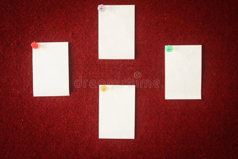 Collection of note papers pinned on a red board ready for filling in quotes.