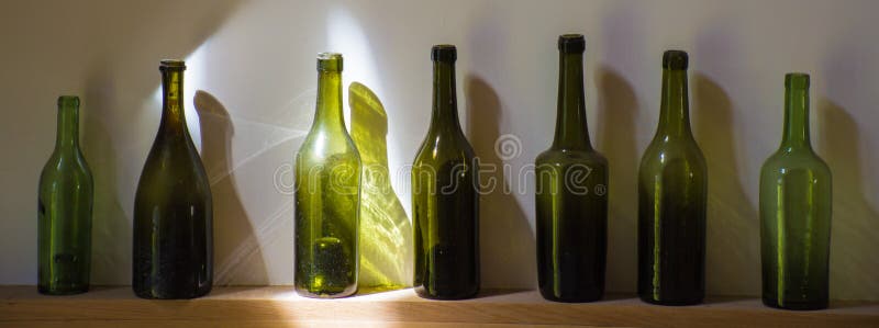 Collection of old dirty green bottles used for apple cider drink stock image Collection of old dirty green bottles used for apple cider drink stock image