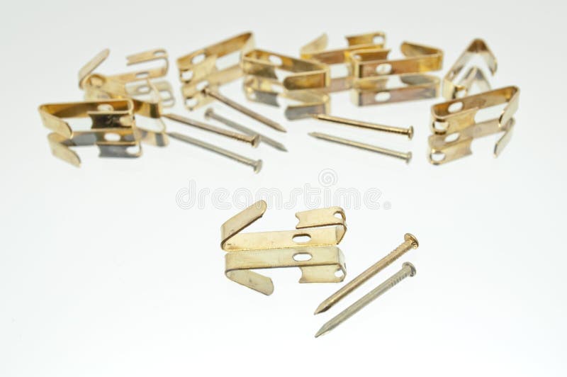 A Collection of Small Lying Metal Picture Hooks with Nails Stock Image ...