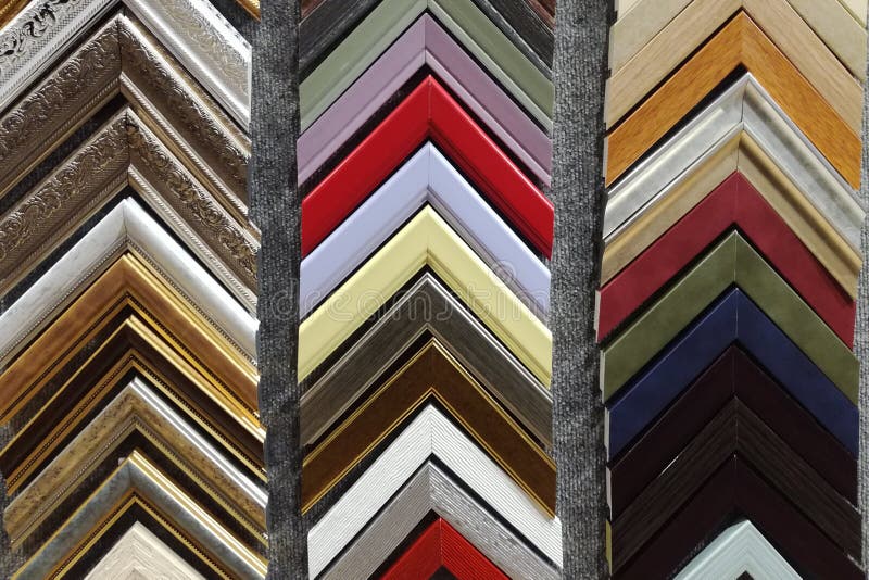 A Collection of Solid Wood Photo Picture Frame Corner Samples are Displayed on a Table Stock