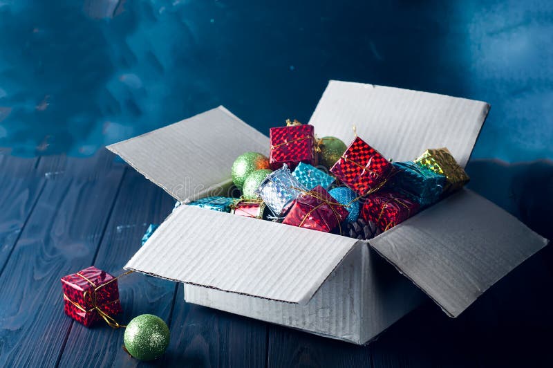 Collection of Various Christmas Decorations, Placed into Cardboard Box