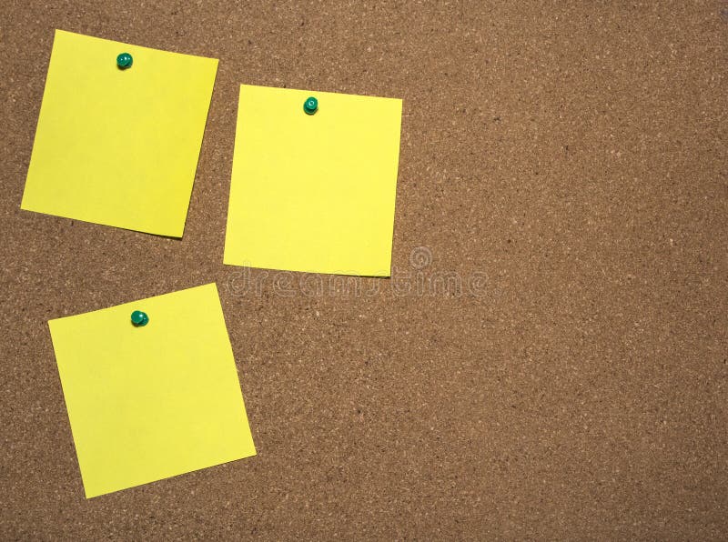 Three Yellow Notes Papers are Pinned on Cork Board for Writing and a