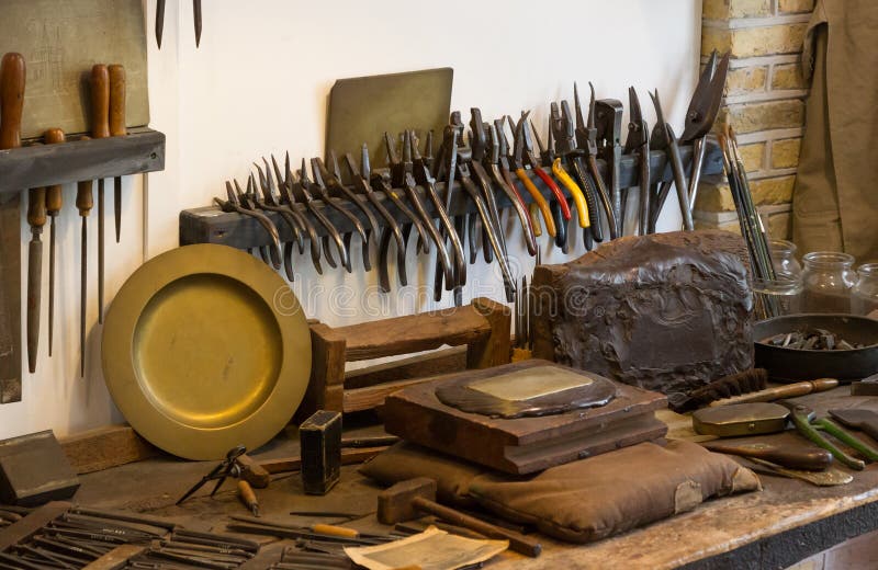Collection of Vintage Woodworking Tools on a Rough Workbench Stock