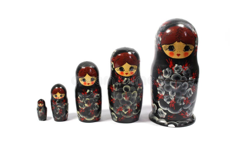 Collection of Wooden Nesting Stacking Dolls on White Background Stock