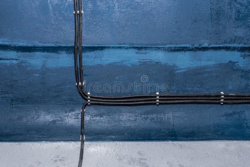 Industrial cable power connection and insulation of electrical wires installation of electricity line on the wall. Industrial cable power connection and insulation of electrical wires installation of electricity line on the wall.