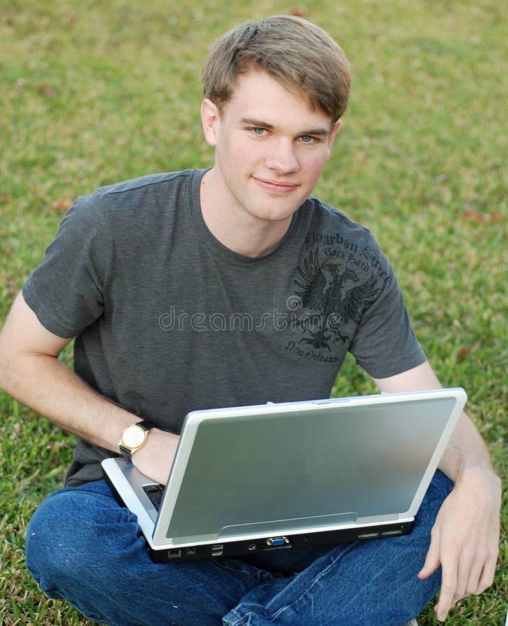 College Boy on a Laptop stock image. Image of handsome 12003657