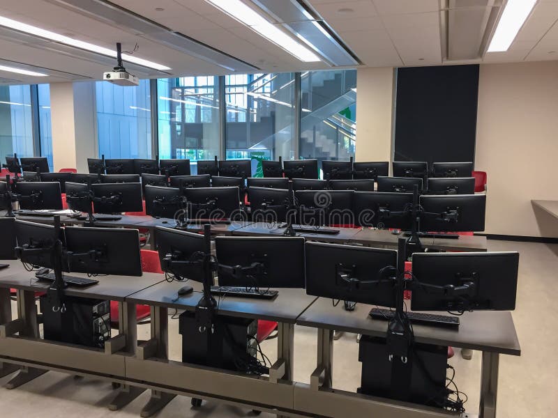 College classroom with computers on every desk royalty free stock photo College classroom with computers on every desk royalty free stock photo