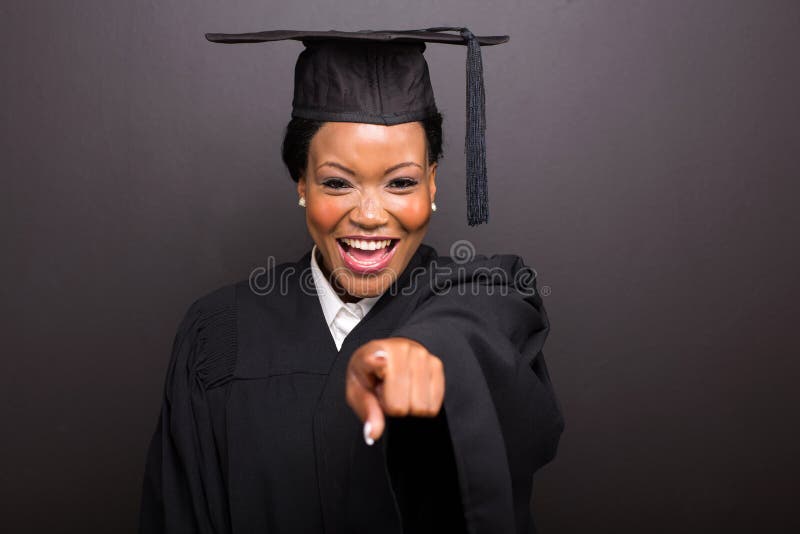 College graduate pointing royalty free stock photo