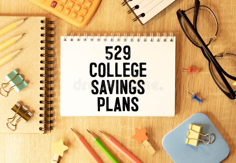 529 College Savings Plan Form with Small Graduation Hat, Spectacles and Pen Over White