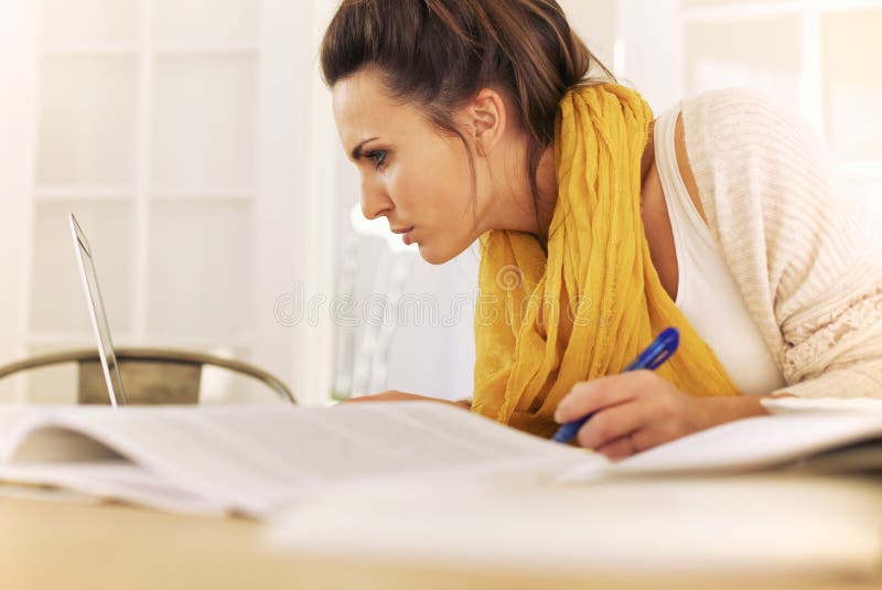 College Student Busy with Home Study royalty free stock image College Student Busy with Home Study royalty free stock image
