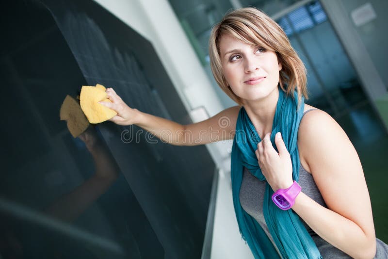 College student erasing the blackboard