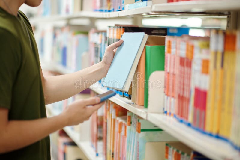 College Student Taking Book from Shelf Stock Image Image of college