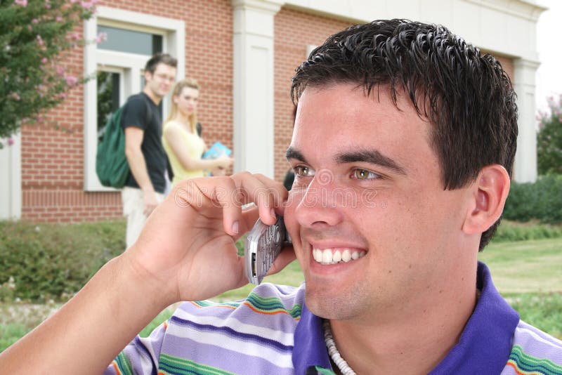 College Student Talking On Cell Phone On College C