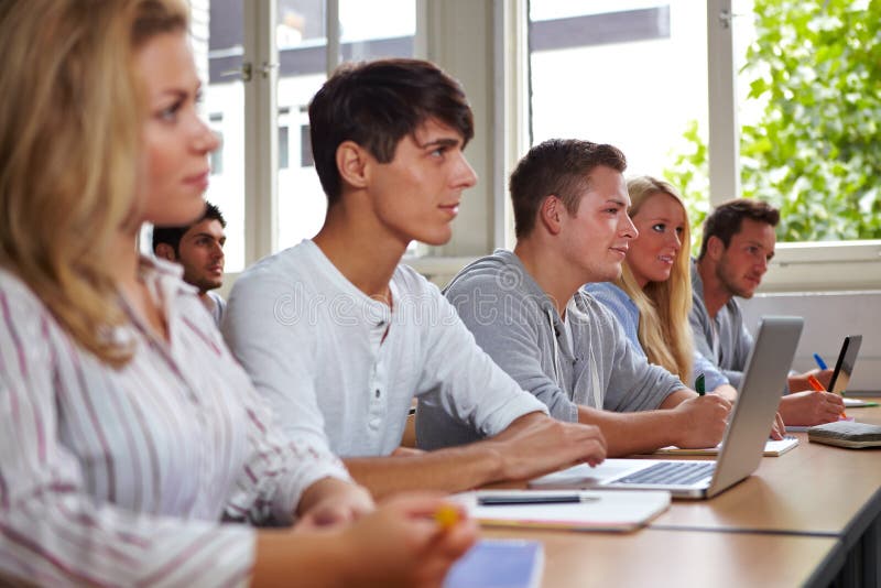 College students in class stock image. Image of listen - 21324335