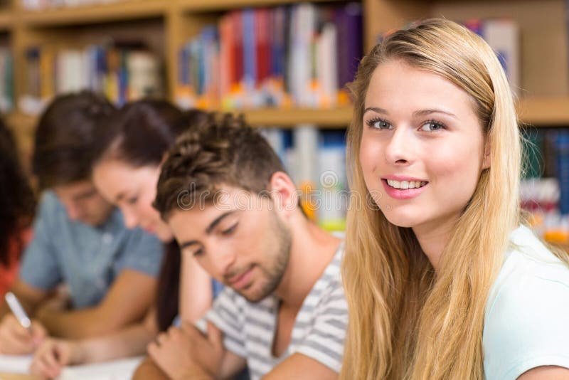 College Students Doing Homework in Library Stock Photo Image of four, information 50485340