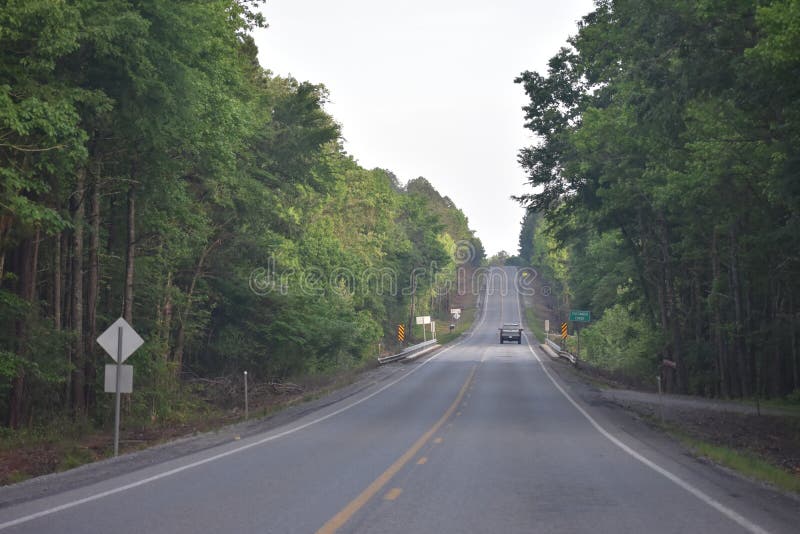 This is Hwy 259 headed South toward Beavers Bend in Oklahoma. Eastern Oklahoma and Western Arkansas has some great Country for a great getaway drive. This is Hwy 259 headed South toward Beavers Bend in Oklahoma. Eastern Oklahoma and Western Arkansas has some great Country for a great getaway drive.