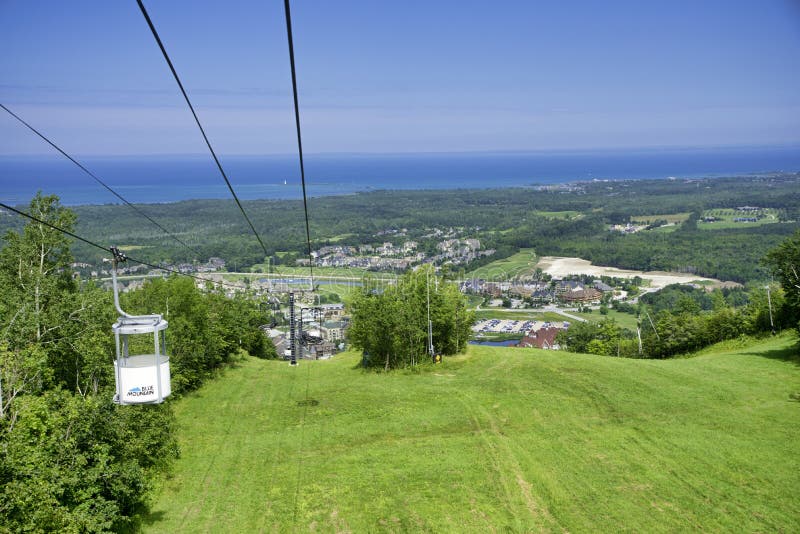 COLLINGWOOD, ON, CANADA - JULY 20, 2017: View of gondola chairlift on top of Blue Mountain Ski Resort during summer time