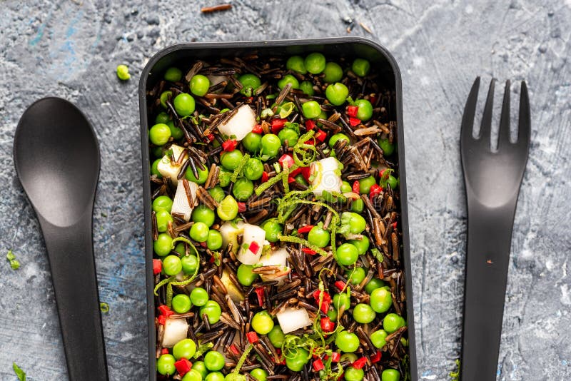 Coloful Healthy Pea and Wild Rice Salad in Bento Box Stock Photo