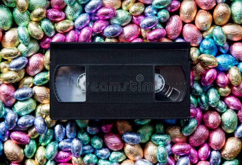 Color Chocolate Easter eggs and VHS cassette stock image Color Chocolate Easter eggs and VHS cassette stock image