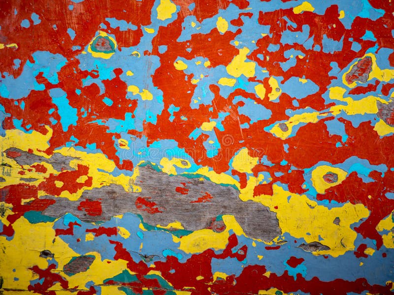 Color cracks,red,yellow,green,blue. Abstract art background. Old oil paint on the wooden floor