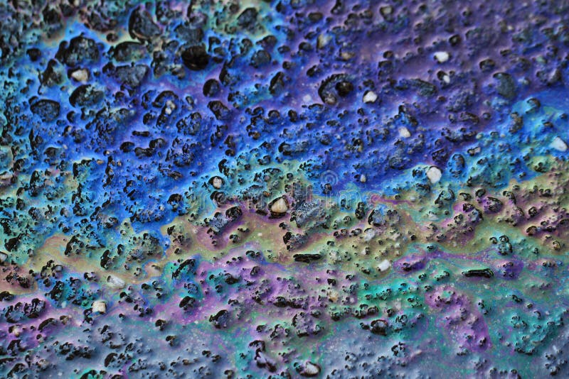 Color Gasoline Fuel Spot On Black Asphalt Royalty Free Stock Photos