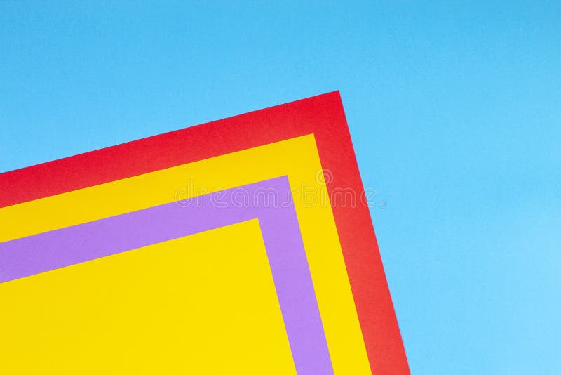 Color papers geometry flat composition background with yellow red purple and blue tones royalty free stock photos