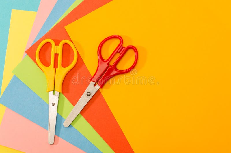 Color papers with scissors paperwork art stock photography