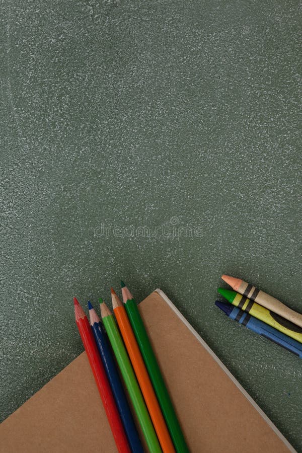 Color Pencil, Crayons and Book on Chalkboard Stock Photo Image of