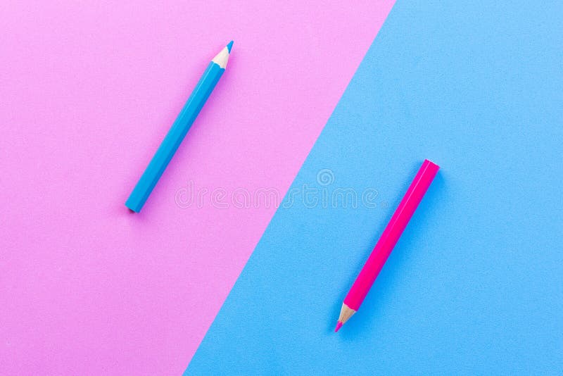 Color pencils on pink blue rubber foam sheet background, color different concept. Color pencils on pink blue rubber foam sheet background, color different concept