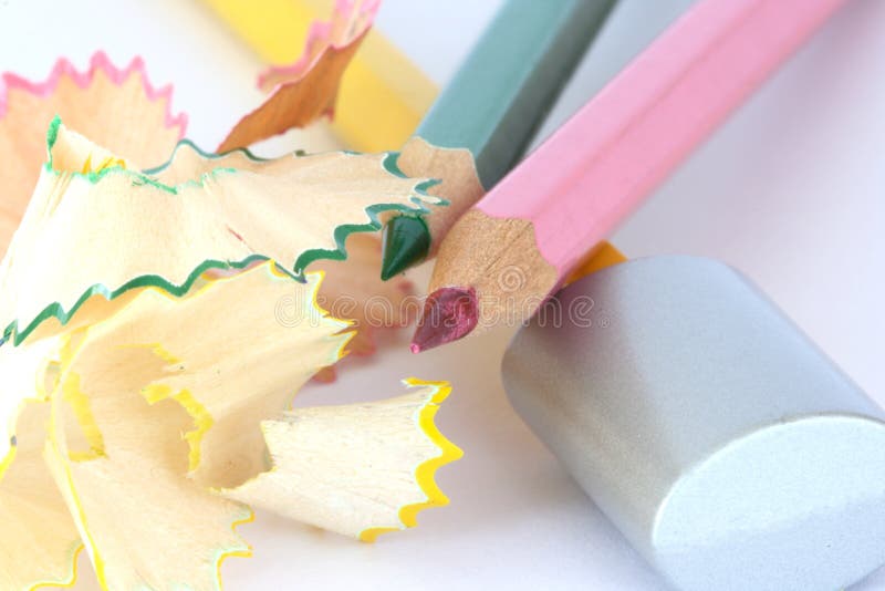 Color pencils with sharpener and shavings royalty free stock photo