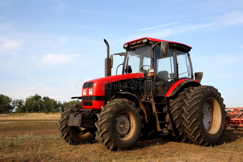 Color Photo Of A Red Tractor Royalty Free Stock Image - Image: 23626976