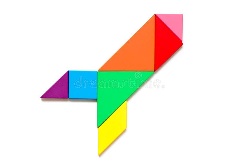 Color wood tangram in rocket or missile shape on white background royalty free stock photography