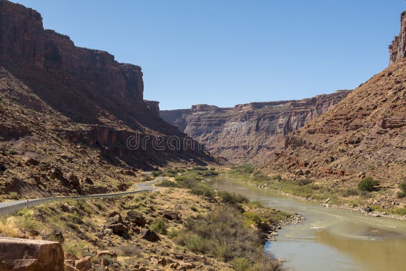 Colorado river with red rocks on both sides at scenic byway B128 in Utah, close to Arches national Park and Moab. Colorado river with red rocks on both sides at scenic byway B128 in Utah, close to Arches national Park and Moab.
