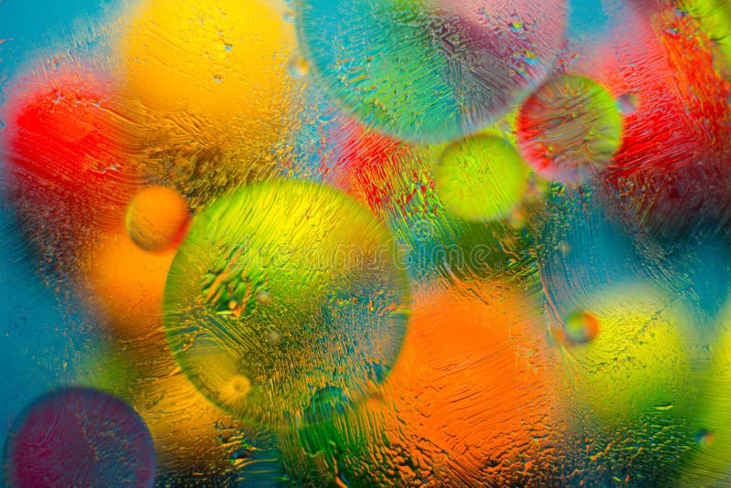 Colored background when mixing water, oil and ointment. stock photos