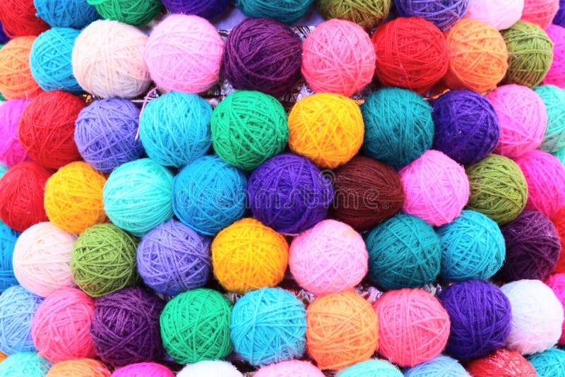 Background of colored balls of yarn thread.