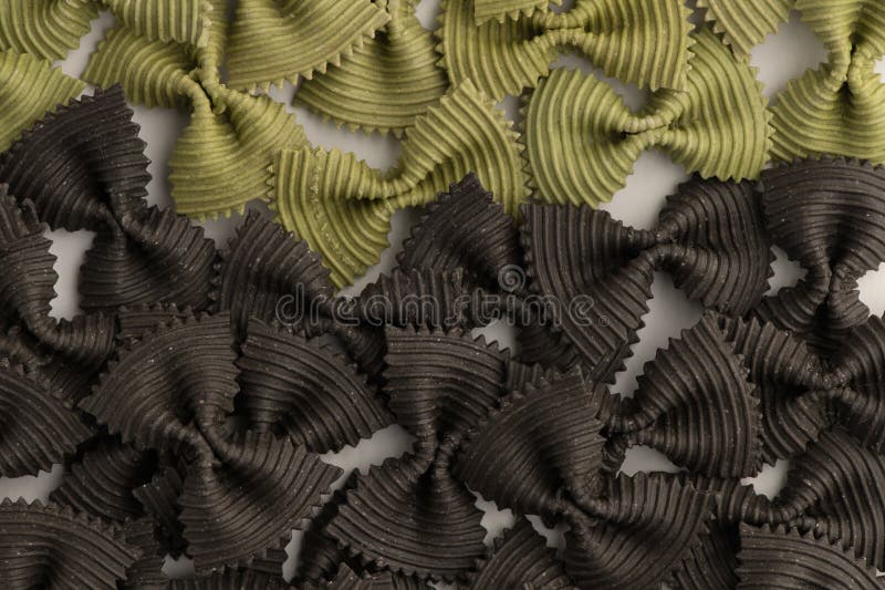 Colored Bow Tie Pasta. Closeup Multiple Farfalle Isolated on White