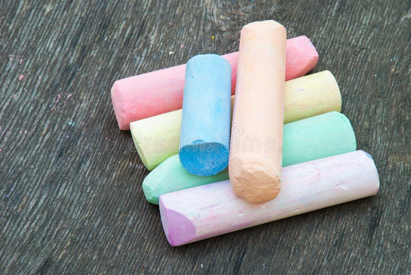 Colored chalk for drawing on a wooden background stock photo Colored chalk for drawing on a wooden background stock photo