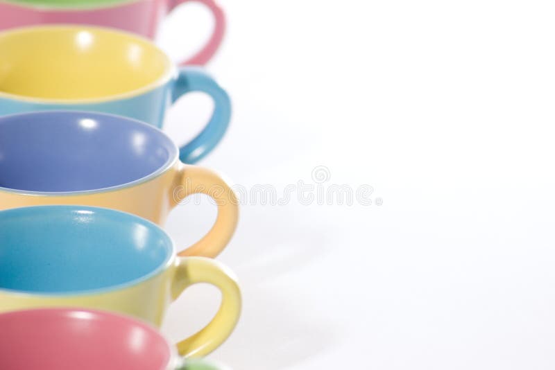 Colored coffee cups to the left