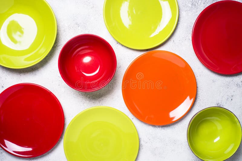 Colored Dinnerware Red and Green Plates on Light Stone Table. Stock Photo Image of flat