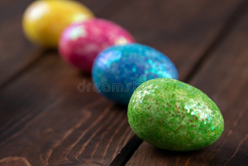 Colored easter eggs placed in line. holiday concept with copy space, side view stock image Colored easter eggs placed in line. holiday concept with copy space, side view stock image
