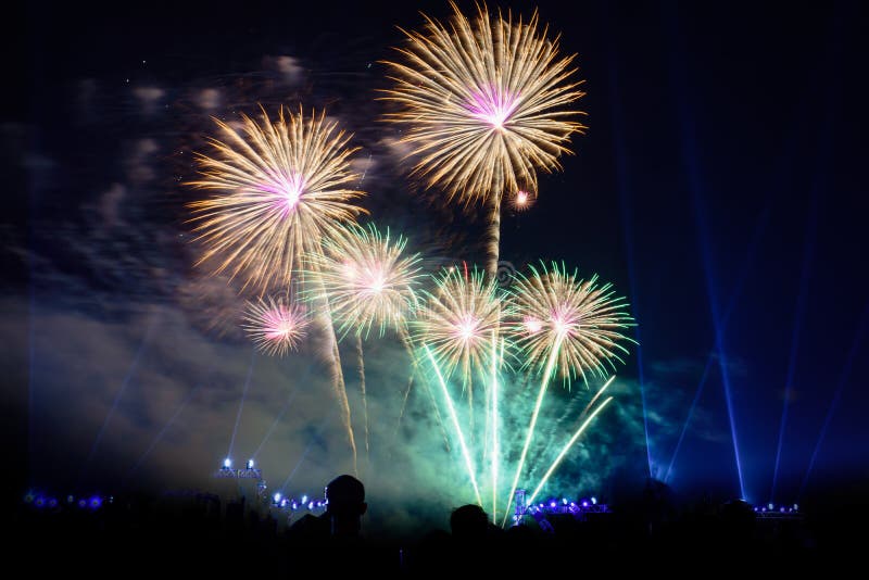 Colored firework background with free space for text. Colorful fireworks at night light up the sky with dazzling display stock photos