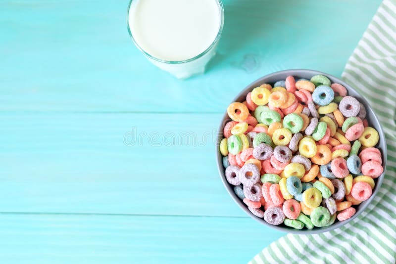 Free Photo  Coloured fruity loops and milk on pink background