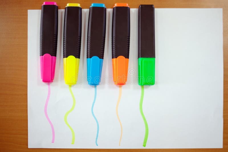 Colored markers on paper. stock photos