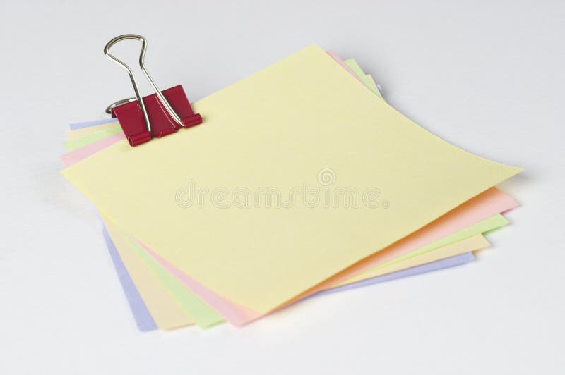 Colored notes with paper clip royalty free stock image