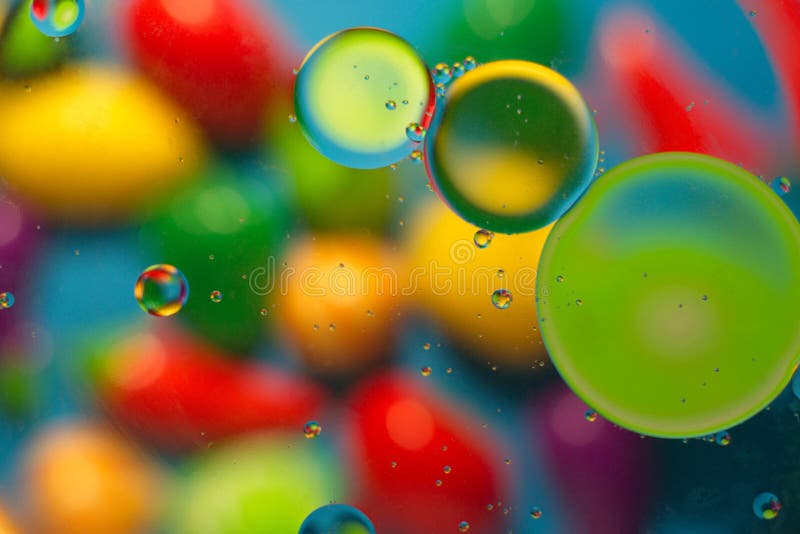Colored objects when mixing water and oil. stock photography