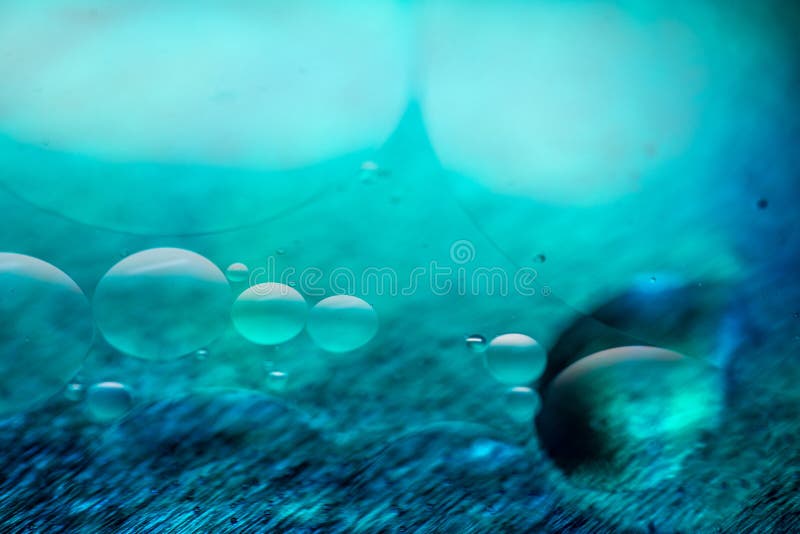 Colored Oil Drops and Bubbles on a Metal Gear Engine Surface. Closeup